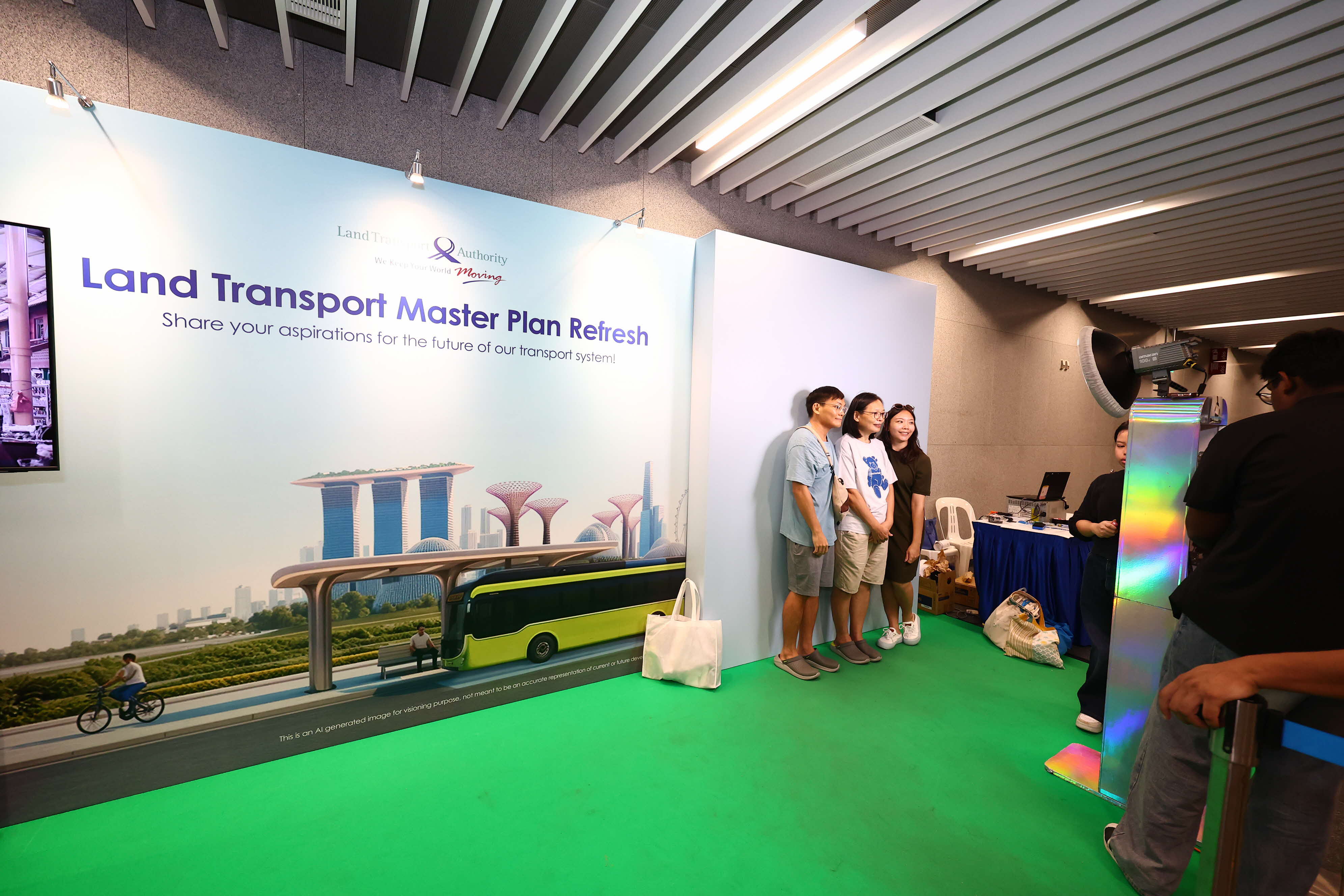 Image of a family taking a photo against the LTMP booth backdrop
